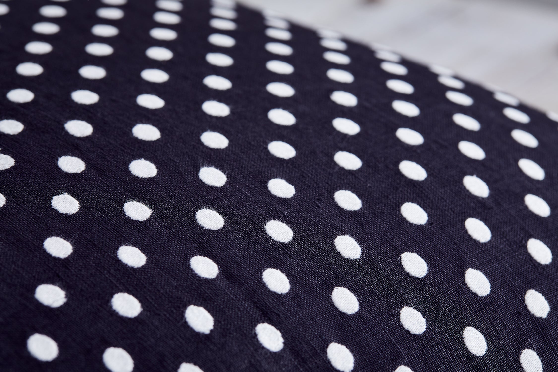 Polka embroidered cushion cover