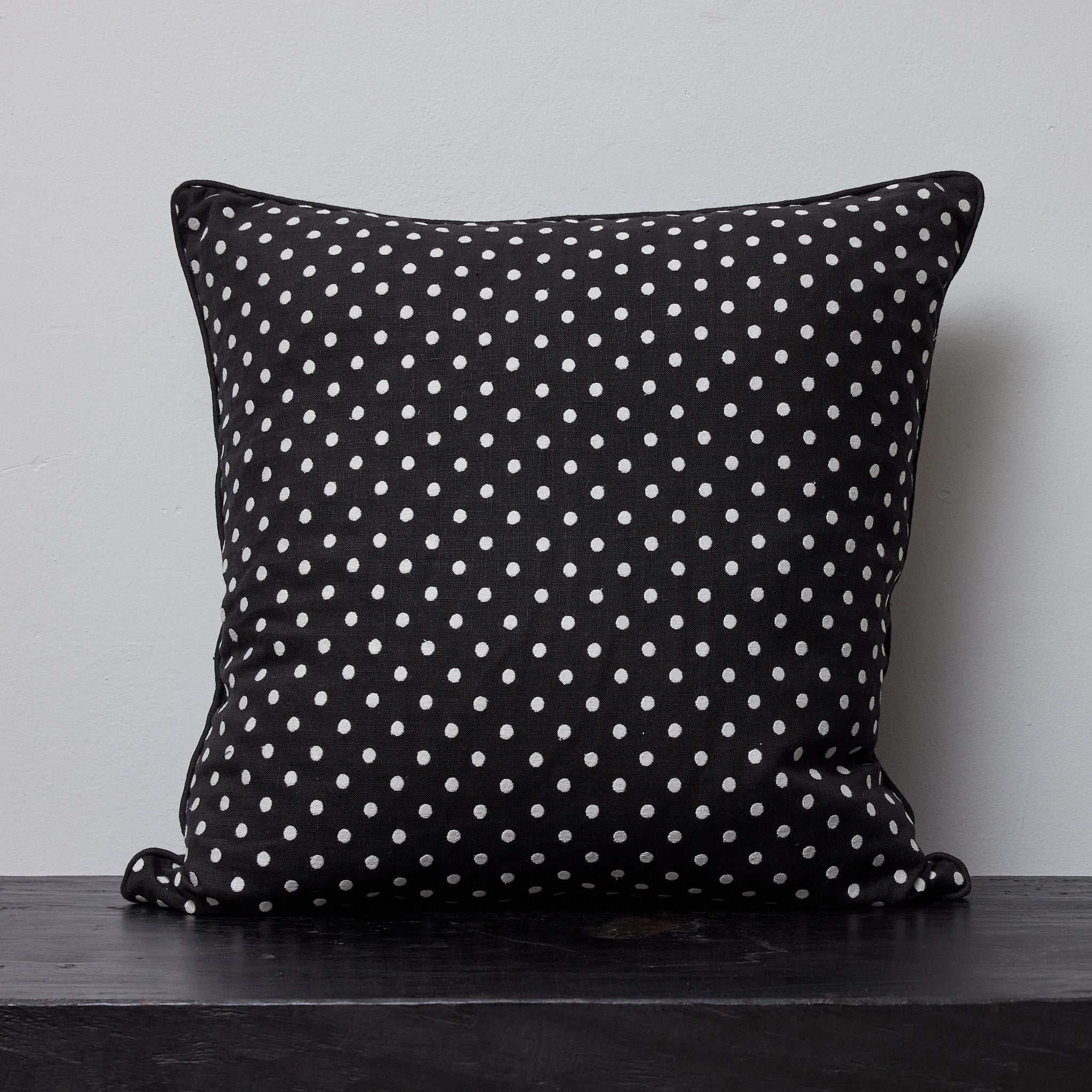 Polka embroidered cushion cover