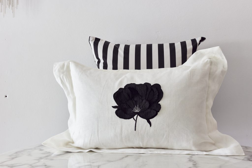 Ifuru Black Raw Silk Flower on White Linen cushion cover with Flange