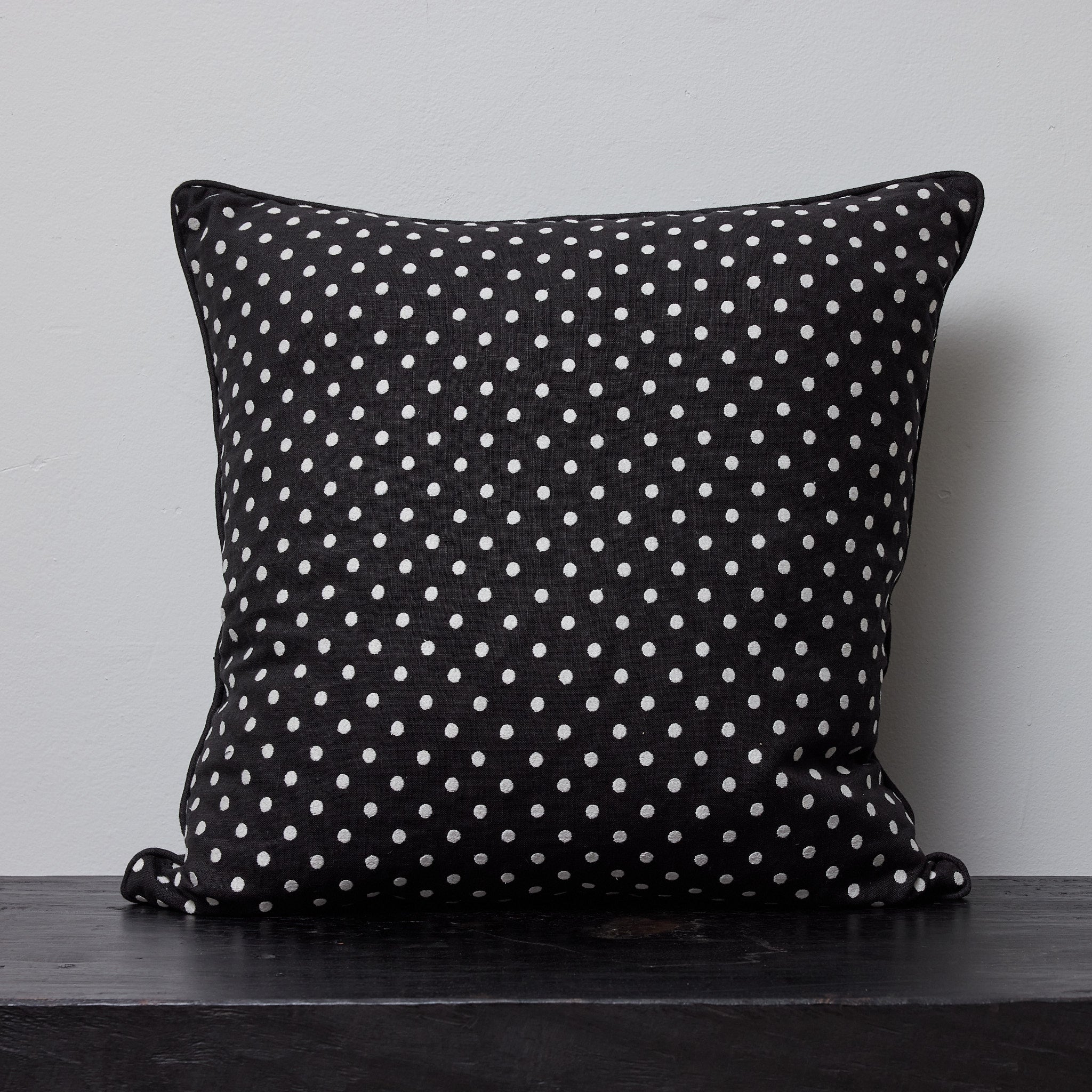 Polka embroidered cushion