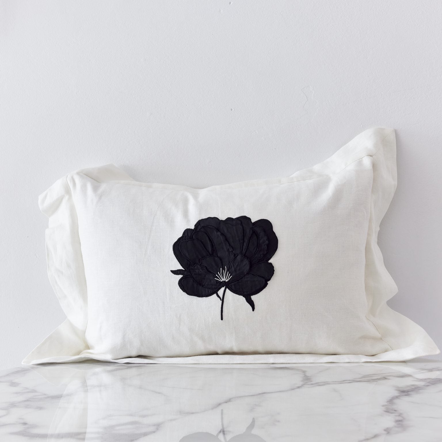 Ifuru Black Raw Silk Flower on White Linen cushion cover with Flange