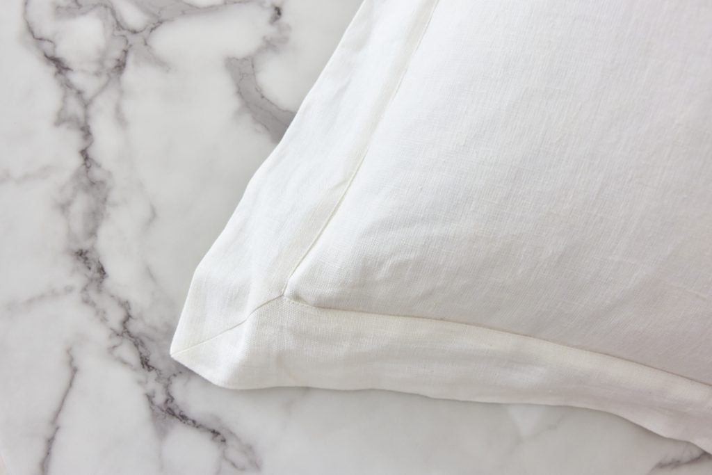 Ifuru Black Raw Silk Flower on White Linen cushion cover with Flange